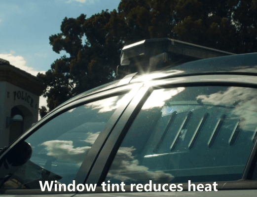 Sunlight reflecting off a vehicle with window tint demonstrating reduced heat inside the cabin